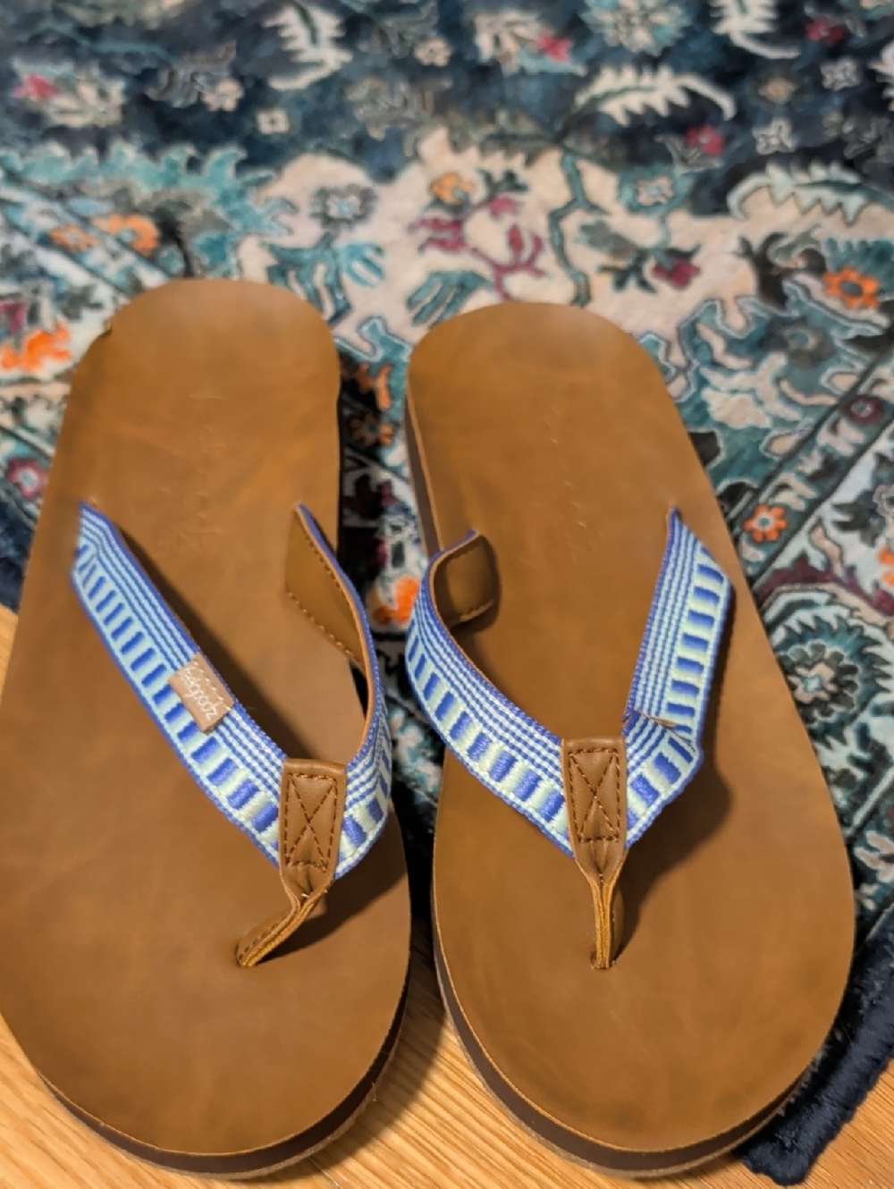 9. Feelgoodz Brown Leather Flip Flops with Blue Patterned Straps